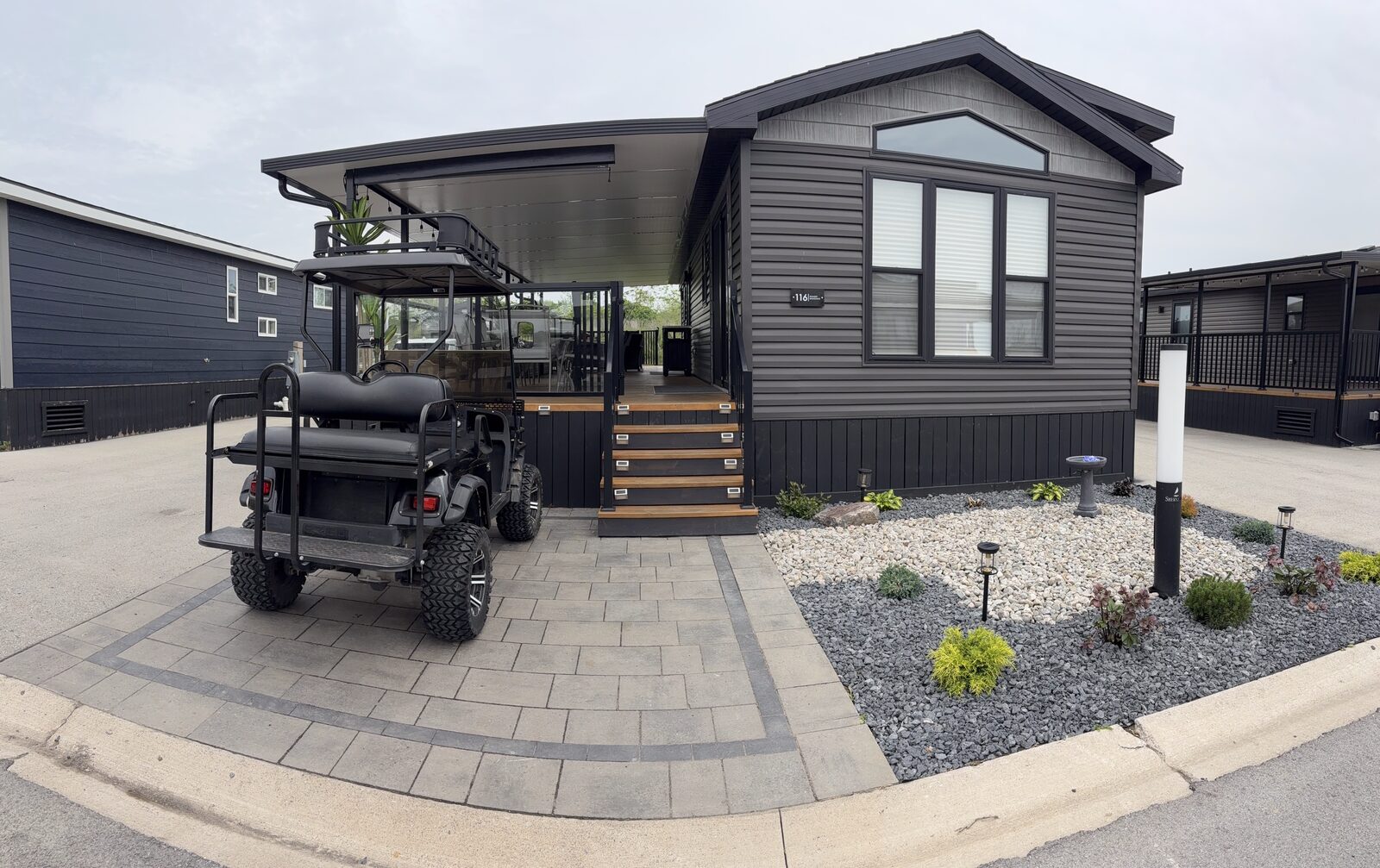 Cottage exterior with golf cart parked out front